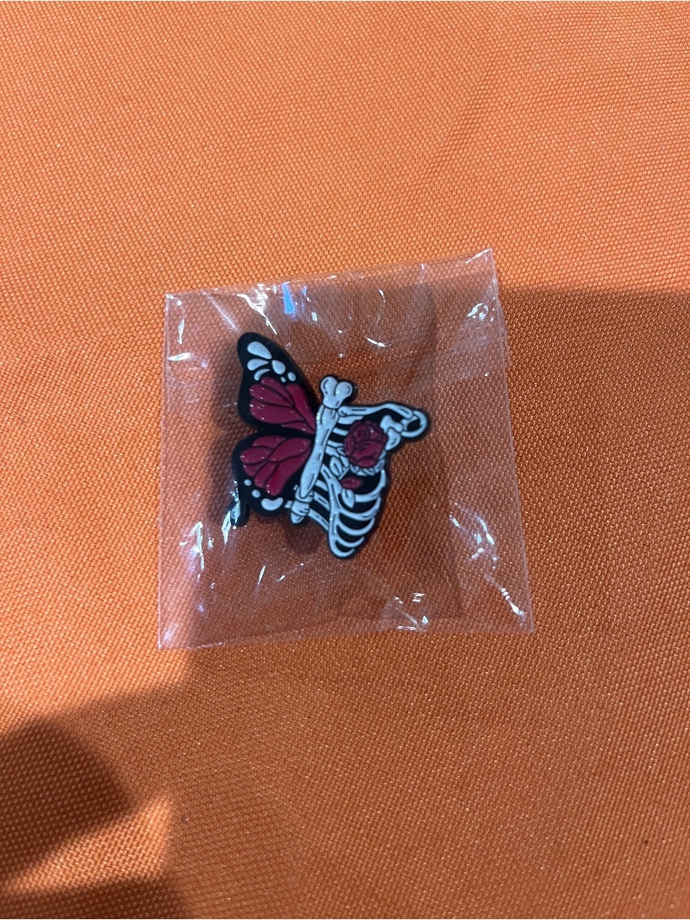 Butterfly Skeleton Enamel Pin in Red and Black